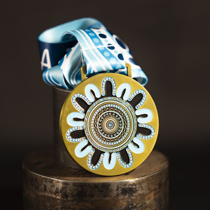 Netball NSW custom event medal with antique gold finish.