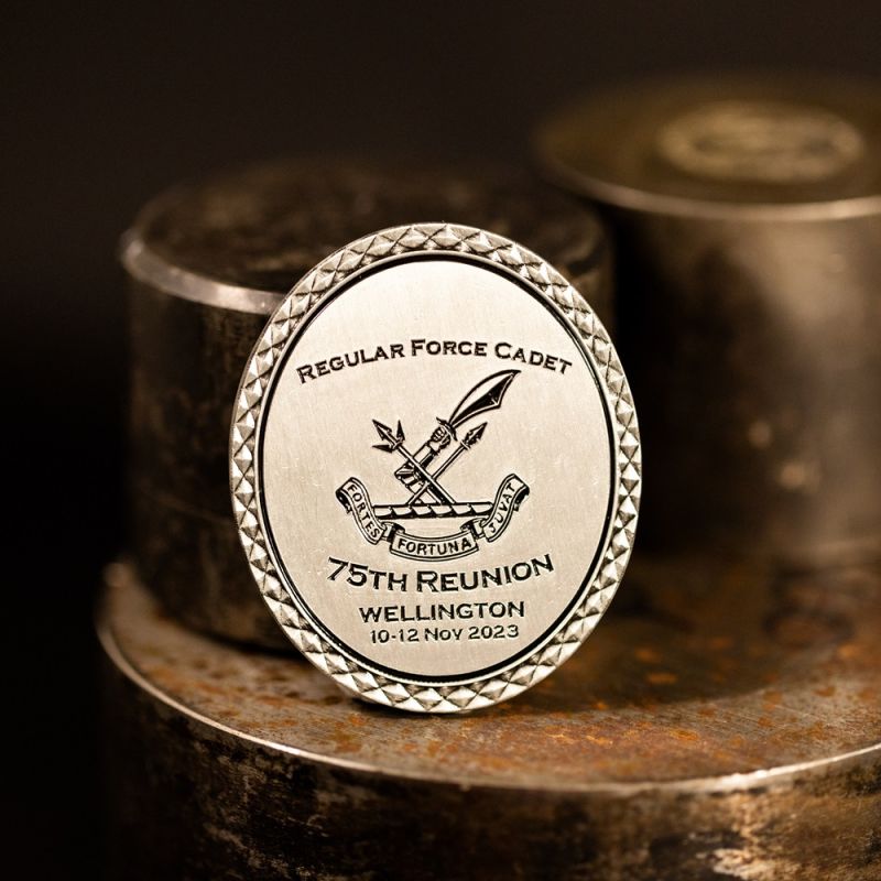 Custom New Zealand Army 'Regular Force Cadet' challenge coin in antique silver finish, with a custom design in the centre. The logo is coloured with enamel. 