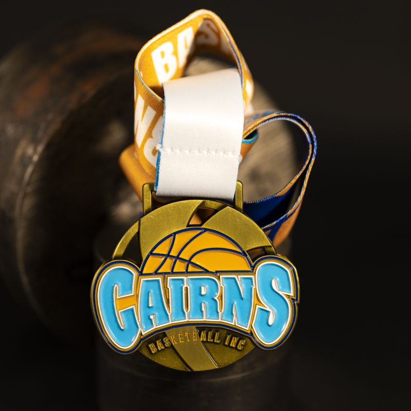 Cairns Basketball custom event medal with antique gold finish.