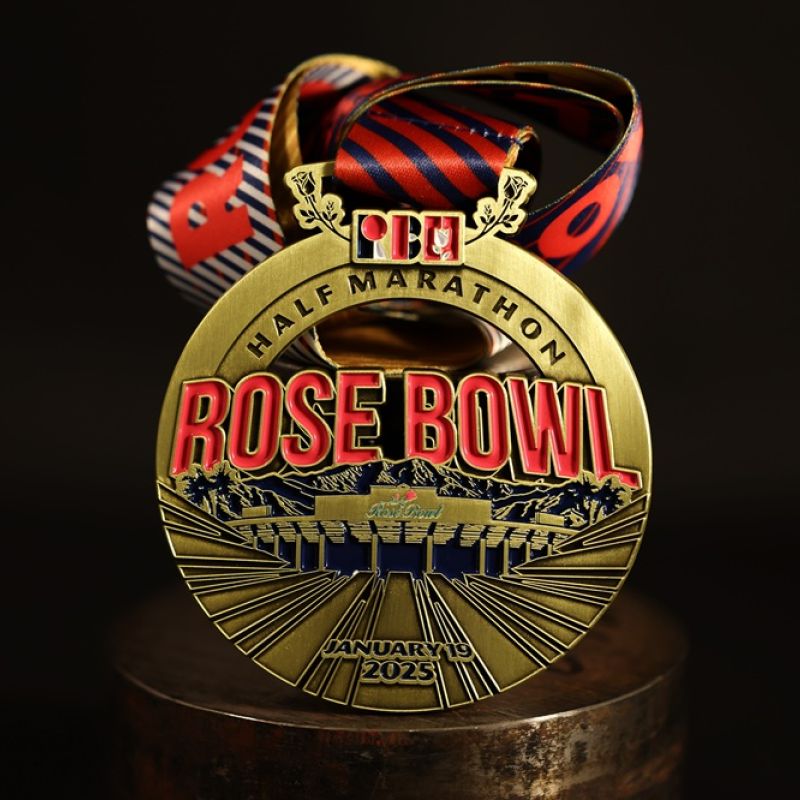 Metal Nike Melbourne Marathon custom event medal with antique gold finish. The marathon's logo is coloured in with enamel. The medal features a cut out that doubles as a bottle opener in its centre. 