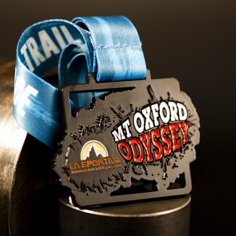 Metal Mt Oxford Odyssey custom event medal with an antique silver finish. The event's logo is coloured in with enamel. The medal features distinctive cut outs and a custom shape..