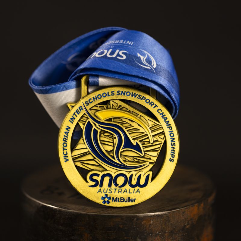 Snow Australia custom event medal with antique gold finish.