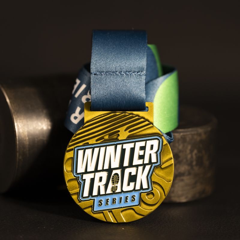 Winter Track Series custom event medal with antique gold finish.