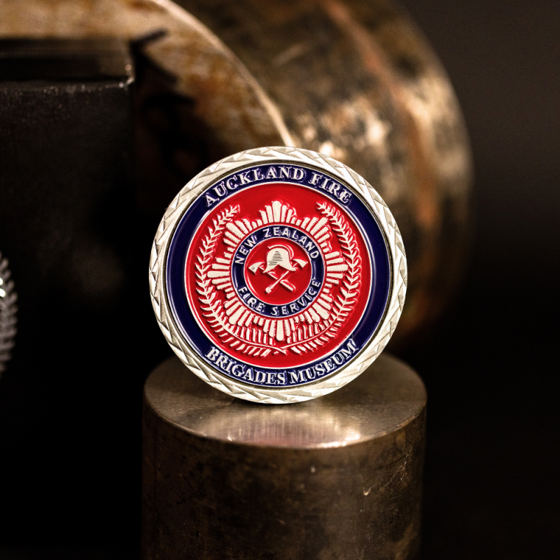 Custom Southern Rugby Football Club challenge coin in antique gold finish, with the club's logo in the centre. The logo is coloured with enamel.