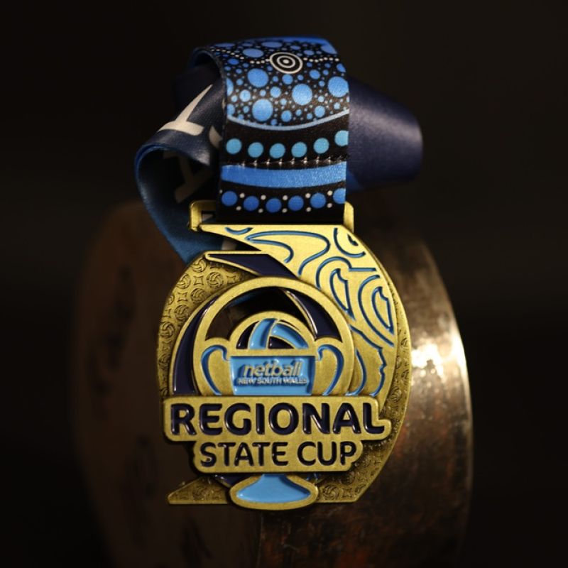 Northern NSW Football custom event medal with antique gold finish.