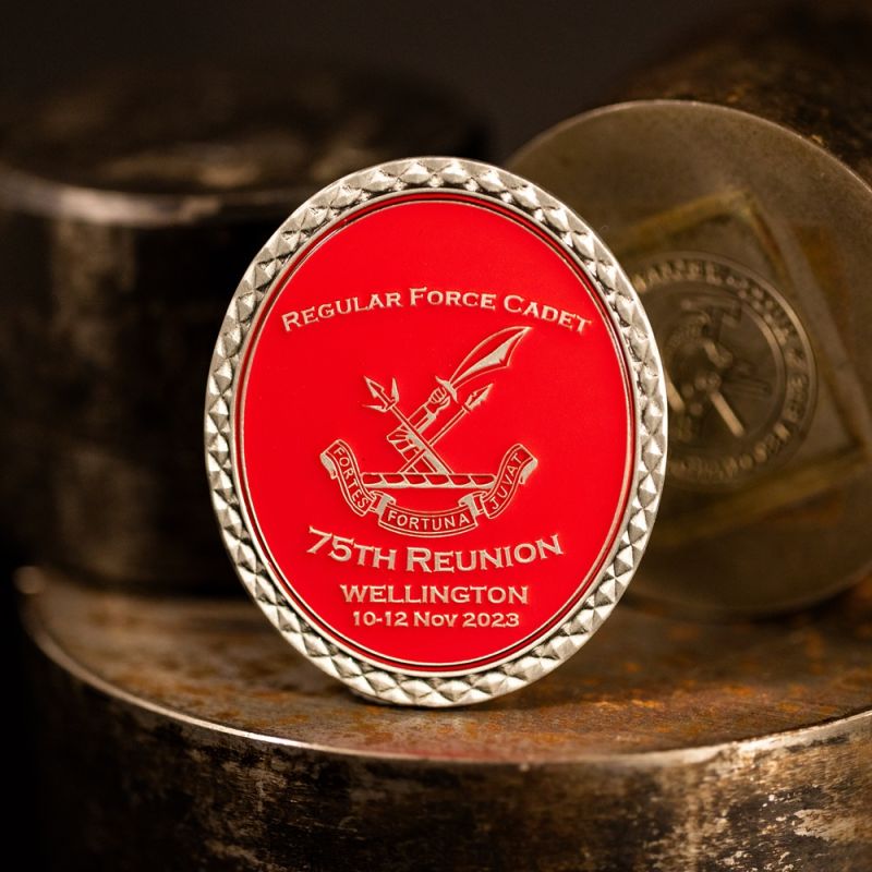 Custom New Zealand Army 'Regular Force Cadet' challenge coin in antique silver finish, with a custom design in the centre. The logo is coloured with enamel. 