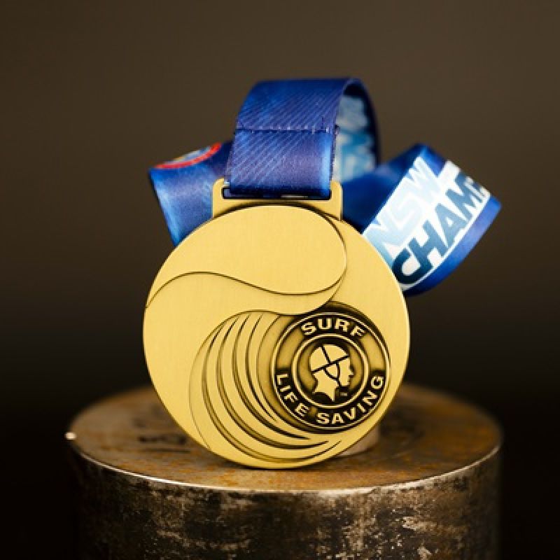 Metal Surf Life Saving NSW custom event medal with an antique gold finish. 