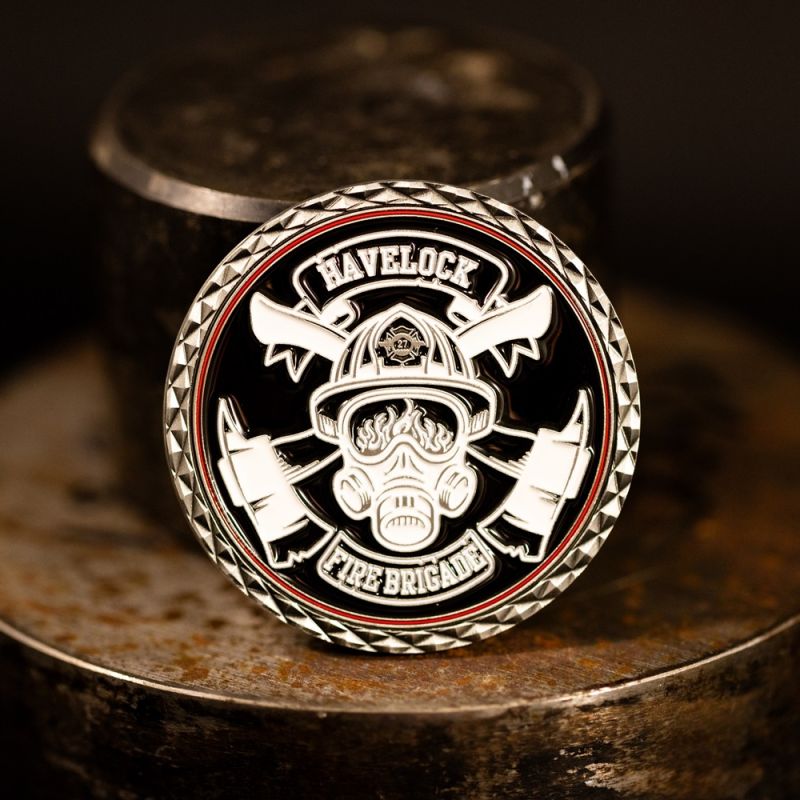 Custom Havelock Fire Brigade challenge coin in antique silver finish, with a custom design in the centre. The logo is coloured with enamel. 
