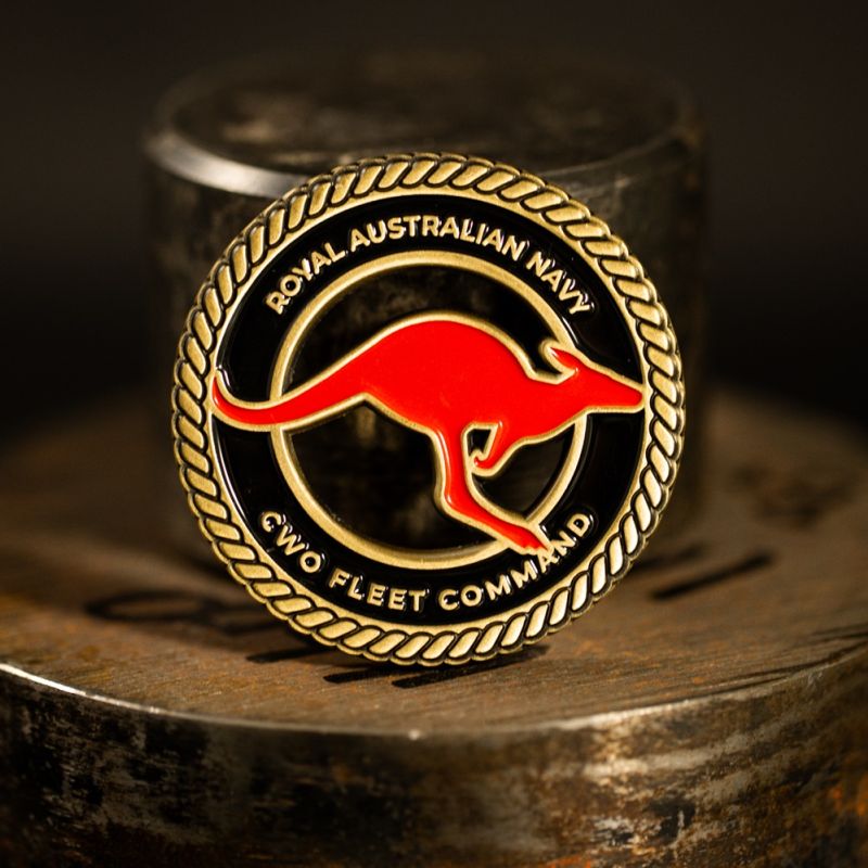 Custom Royal Australian Navy (RAN) challenge coin in antique gold with a cut-out.. 