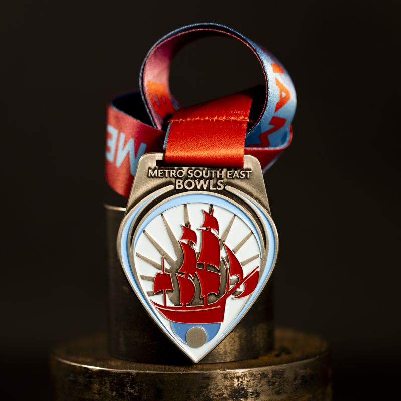 Metro South East Bowls custom event medal with antique silver finish.